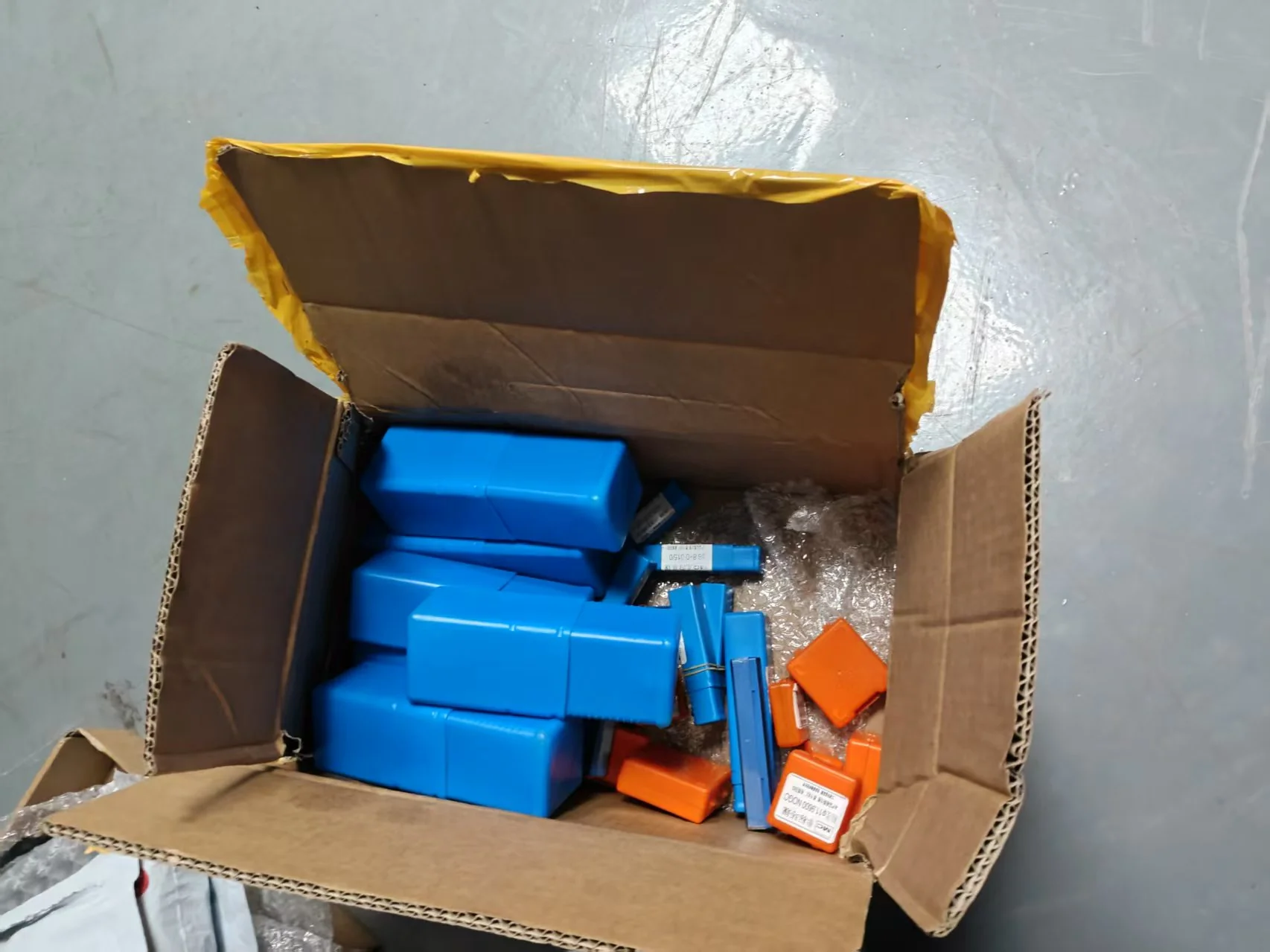 Precision gauge cases packed in a shipping carton with bubble wrap