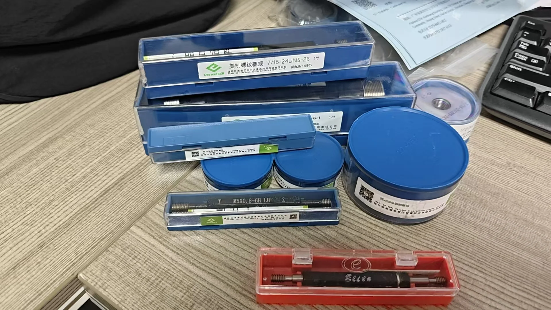 Thread plug and ring gauges in labeled protective storage cases